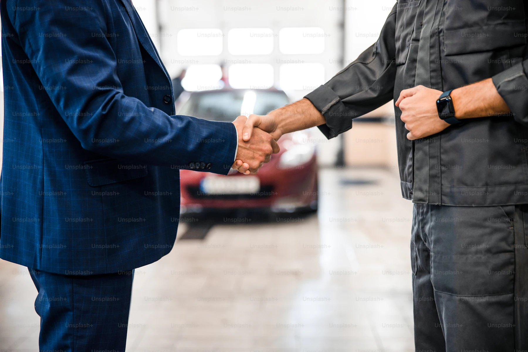 A car consultant shaking hands with a customer