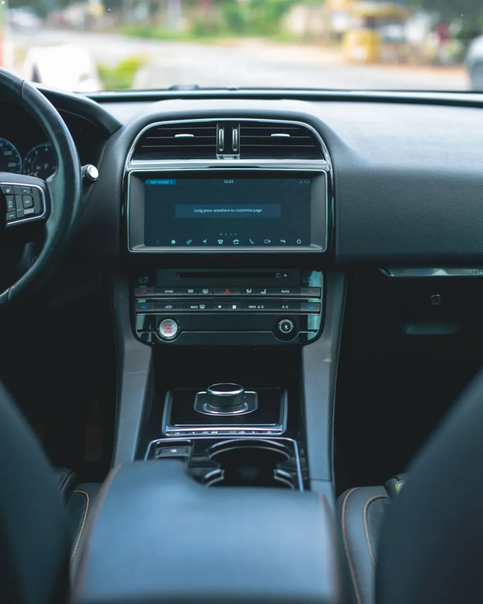 Explore the sleek design of a luxury car interior with high-tech features and premium materials.