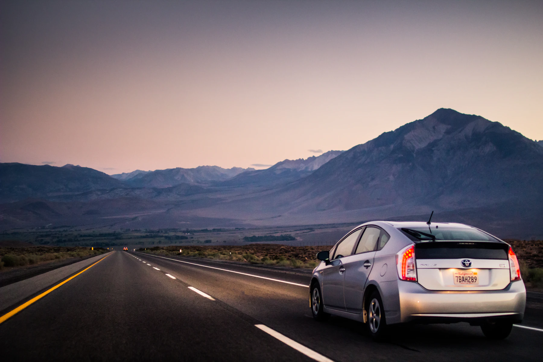 A vehicle driving along an open road